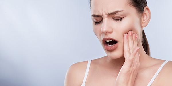 Woman With Toothache emergency root canal